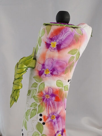 Close-up of painted quilt and side of handle.